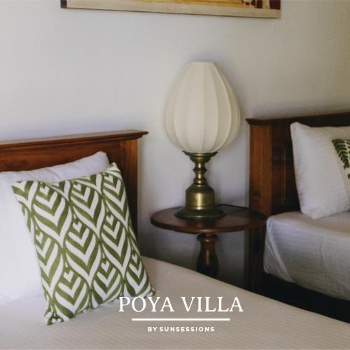 Postel nebo postele na pokoji v ubytování Poya Villa Ahangama