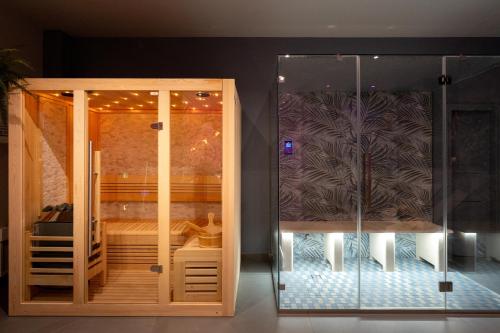 a room with a glass enclosure with a bed in it at Raciti Palace in Acireale