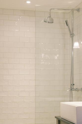 a bathroom with a shower and a sink at Retreat East in Ipswich
