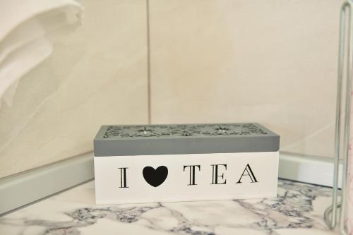 a tea box with a heart on it on a table at 4Rest & 4Joy in Zlatibor