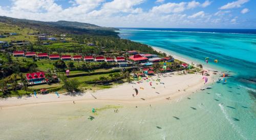 an aerial view of a beach with people in the ocean at C Rodrigues Mourouk in Rodrigues Island