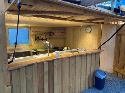 a kitchen with a wooden counter with a sink at Hotel-Restaurant Denklinger-Hof in Reichshof 