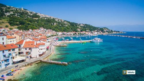 an aerial view of a beach with boats in the water at Villa Valis in Baška