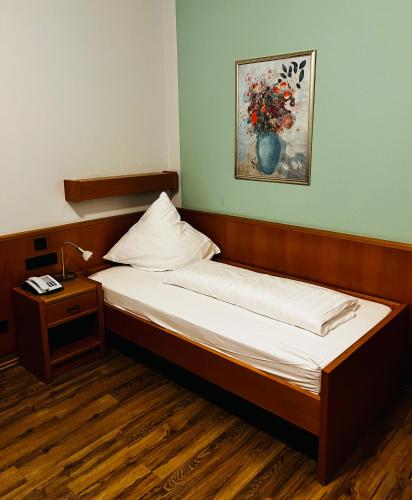 Ένα ή περισσότερα κρεβάτια σε δωμάτιο στο Villa Thea Hotel am Rosengarten