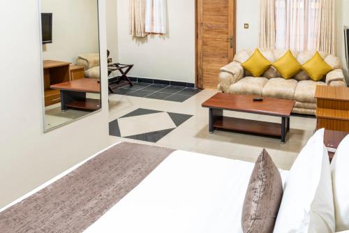 a living room with a couch and a table at Emboita Hotel Limited in Nakuru