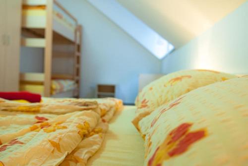 two beds sitting next to each other in a room at Krásný apartmán uprostřed Jeseníků in Bruntál