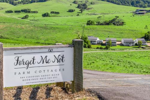 a sign for the forest me met farm cottage at Forget Me Not Farm Cottages in Coopers Shoot