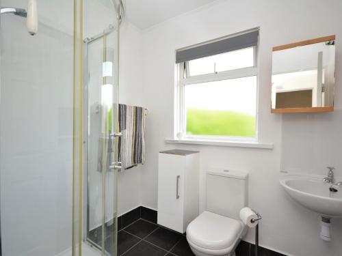 a bathroom with a toilet and a sink at 1 Bed in Tavistock OTWIN in Lamerton