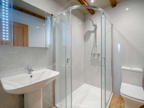 a bathroom with a shower and a sink and a toilet at 2 Bed in Bentham 53510 in High Bentham