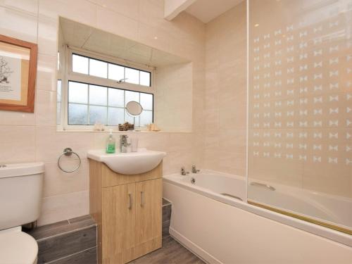 a bathroom with a sink and a tub and a toilet at 2 Bed in Nr Gibside CN080 in Whickham