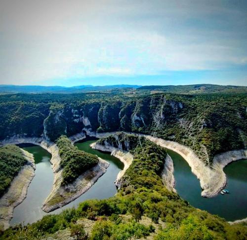 an aerial view of a river in a canyon at Brvnare Kušići in Ivanjica