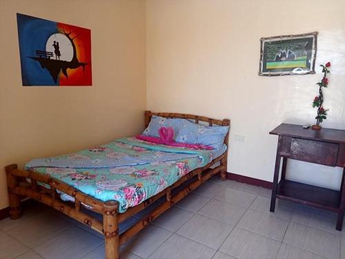 מיטה או מיטות בחדר ב-Malapascua Be One Guesthouse