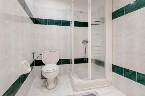 a bathroom with a toilet and a shower at Porto Marina Aparthotel in Gouvia