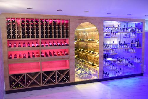 a wine cellar with a bunch of wine bottles at La Luna Rustic Deluxe Apartment with Free Jacuzzi, Bikes & Covered Parking in Našice