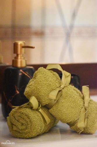 a pair of shoes sitting next to a bottle of soap at Delfi's cozy maisonette in Delfoi