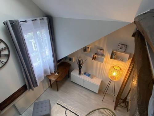 an overhead view of a living room with a window at Ile Saint Louis in Paris