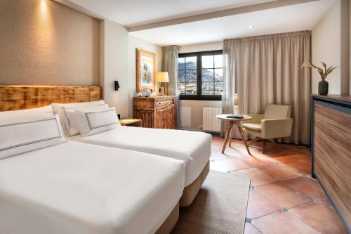Ένα ή περισσότερα κρεβάτια σε δωμάτιο στο Meliá Sol y Nieve