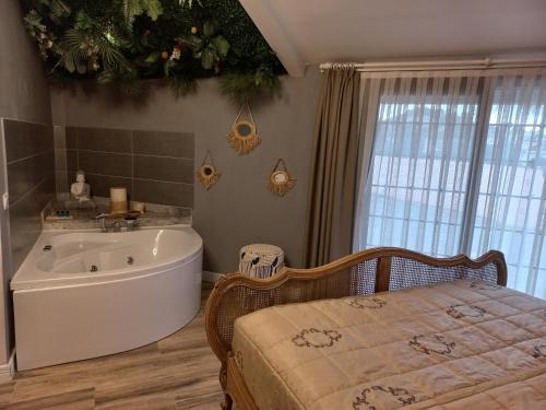 a bathroom with a bath tub and a christmas tree at Chloe hotel Alacati in Alacati