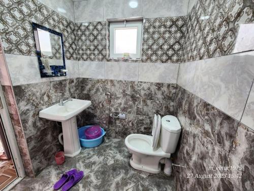 a bathroom with a toilet and a sink at Michael House in Ganja