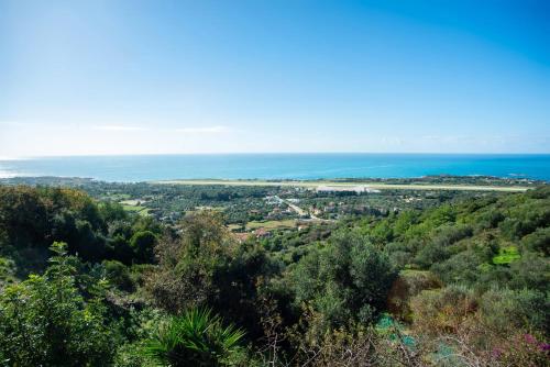a view of the ocean from the top of a hill at Irida's house in Kefallonia