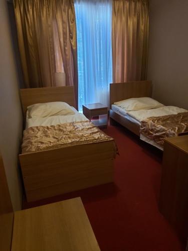 Ein Bett oder Betten in einem Zimmer der Unterkunft Hotel Szablewski