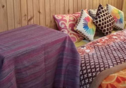 Postel nebo postele na pokoji v ubytování Lolegaon Farmstay by StayApsrt