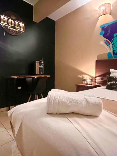 Katil atau katil-katil dalam bilik di Beer Hotel Iguazú