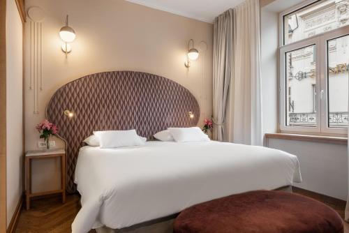 Postel nebo postele na pokoji v ubytování Grand Hotel Union Eurostars