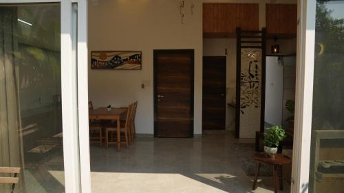 a room with a table and a dining room at The Sky Imperial Sethji Ni Wadi in Indore