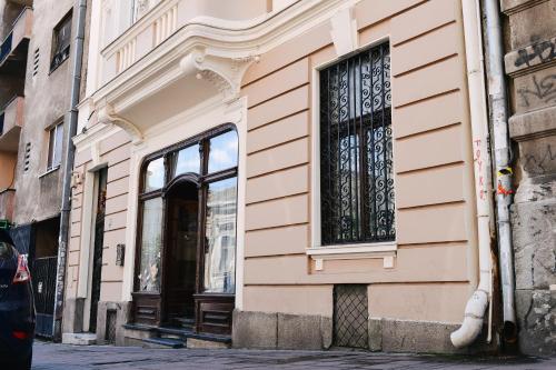 a building with a window on a street at New Generation Hostel Belgrade Center in Belgrade