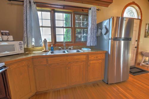 a kitchen with a stainless steel refrigerator and a sink at Premier Cottages by Amish Country Lodging in Berlin