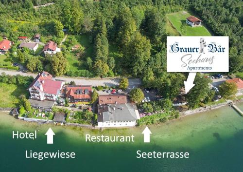 an aerial view of a house on the water at Seehaus am Kochelsee in Kochel