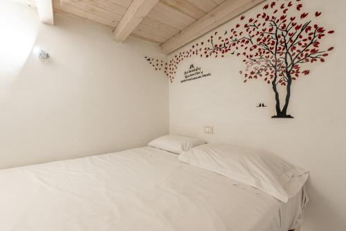 Ένα ή περισσότερα κρεβάτια σε δωμάτιο στο Carini House Near the Cathedral by Wonderful Italy