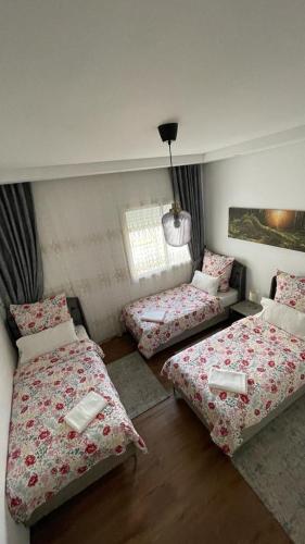 a room with two beds and a couch at Schöne, ruhige neuwertige 127qm Ferienwohnung in Sidi Daoud