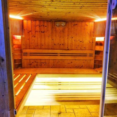an inside of a sauna with the light on at Harmónia Vendégház Tahitótfalu in Tahitótfalu