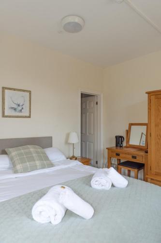 Una cama o camas en una habitación de Horton Inn