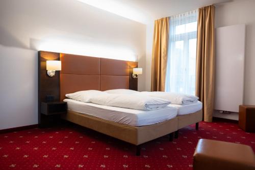 Postel nebo postele na pokoji v ubytování Pucci Bärengarten Stadthotel