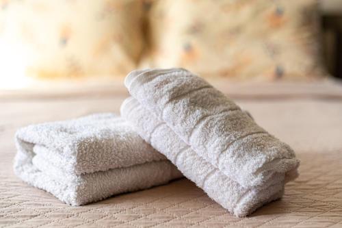 a stack of towels sitting on top of a table at Central Bliss / your perfect home away from home in Limassol