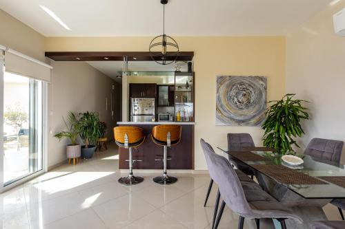 a dining room with a table and chairs at Central Bliss / your perfect home away from home in Limassol