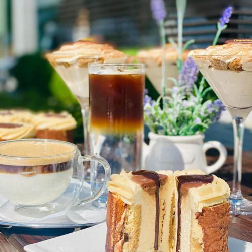 a table with a piece of cake and a cup of coffee at AeroCafe in Partizánske