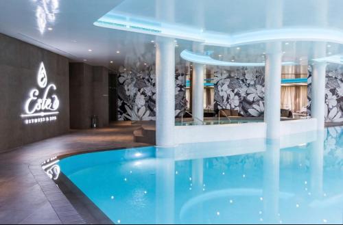a room with a swimming pool in a building at Luxury Gated Apartment in Sofia