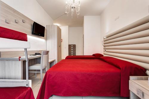 Ένα ή περισσότερα κρεβάτια σε δωμάτιο στο Hotel Buratti