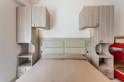 Ένα ή περισσότερα κρεβάτια σε δωμάτιο στο Hotel Buratti