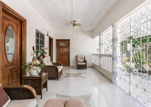 a living room with a couch and a chair at Joyful Ambiance Retreat in Bushy Park