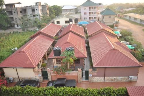 an overhead view of a house with red roofs at Santa Monica Home Lodge in Senchi