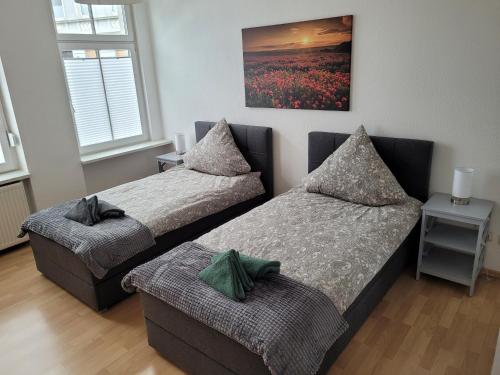 Tempat tidur dalam kamar di Wohnung in Oberhausen: zentral & ruhig, eigener Eingang