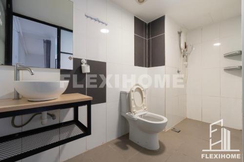 a bathroom with a white toilet and a sink at 1-5 Guests, Spacious & Comfy Duplex-Studio, Empire City Damansara by Flexihome-MY in Petaling Jaya