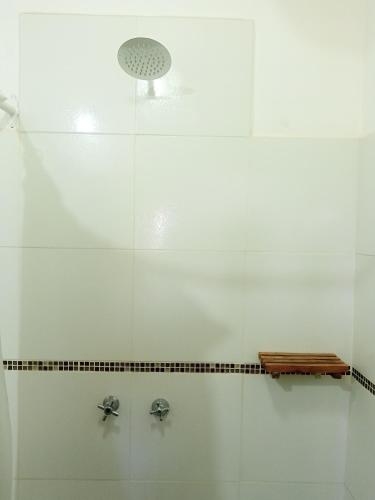 a shower with two faucets in a bathroom at Casa Inkill Huasi in Tilcara