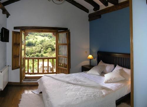 En eller flere senge i et værelse på La Casa De Las Arcas