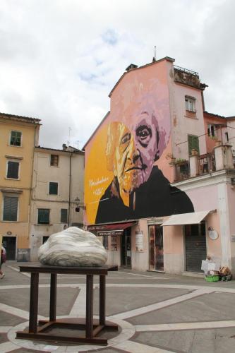 a mattress sitting on a table in front of a building at La Porta sui Monti di Luna in Carrara